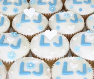 Blue & White Muffins - Our all butter Lemon sponge, made with freshly grated lemon zest, and the juice is used to make our tangy lemon icing.  Decorated with some hand made decorations for a wedding.