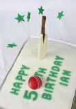 Cricket Cake - All butter lemon sponge, filled with zingy lemon curd and iced with a lemon glace icing.  Decorations include a hand made cricket ball and bat.